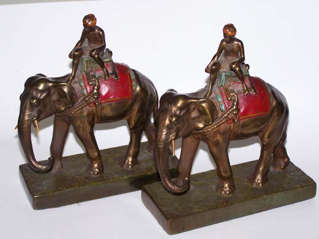 A fine and unusual Pair of Antique Bookends circa 1930 depicting a turbaned man riding an Elephant — image 2